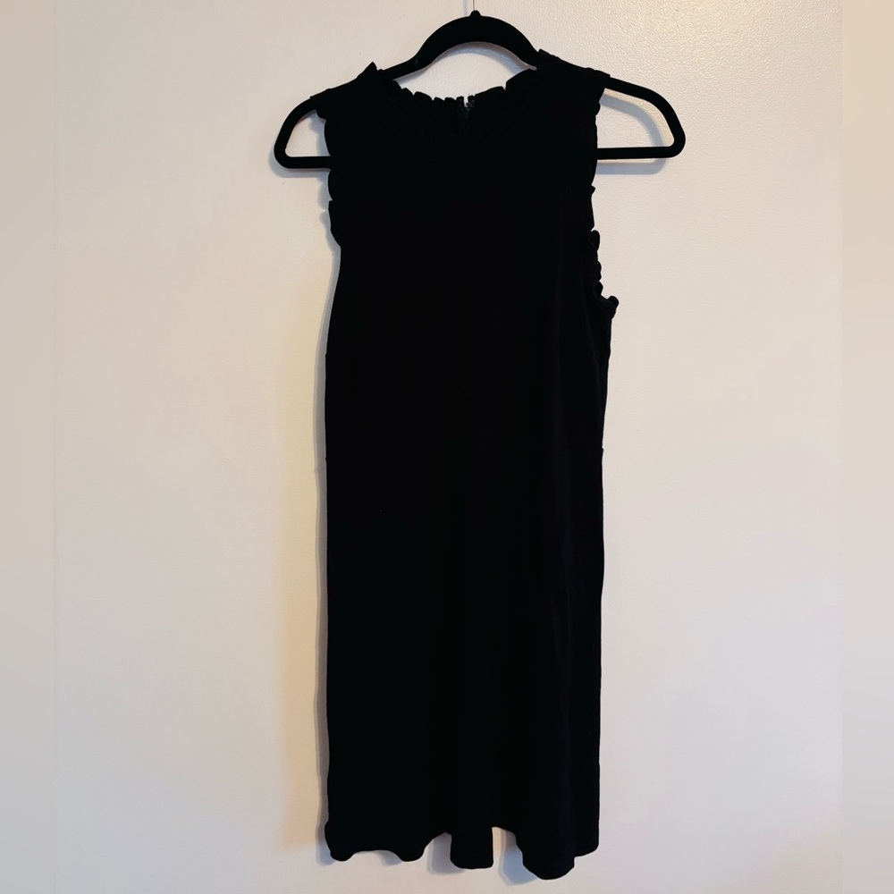 Little black dress with high neck and ruffle along the neckline size medium